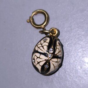 Blue enamel egg charm pendant with white enamel moth/butterfly